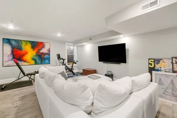 a living room with flat screen tv