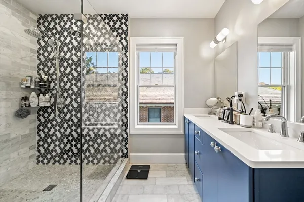 a bathroom with a sink a vanity and a shower