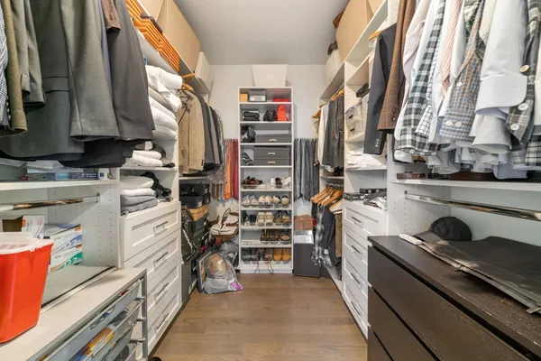 a view of a kitchen with fridge and rack