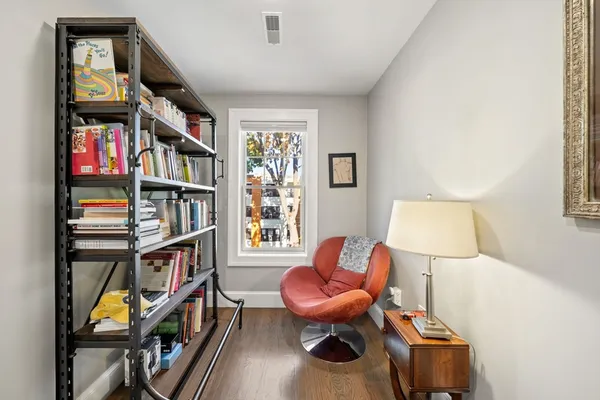 a room with a book shelf and a book shelf