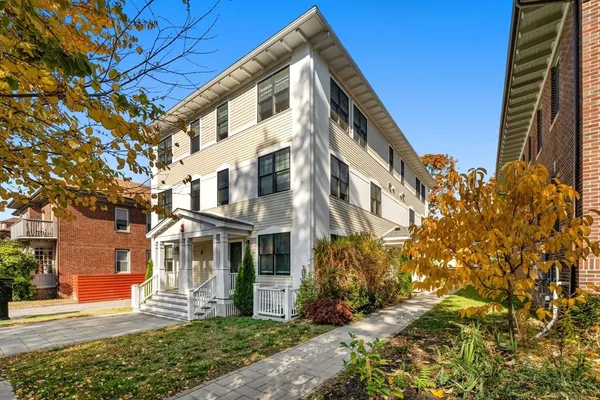 a view of a building with a yard