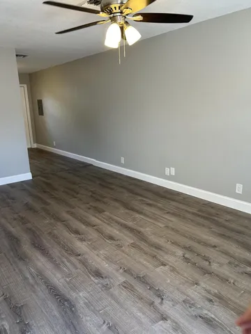 a view of an empty room with a window