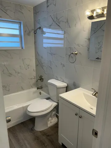 a bathroom with a sink toilet and bathtub