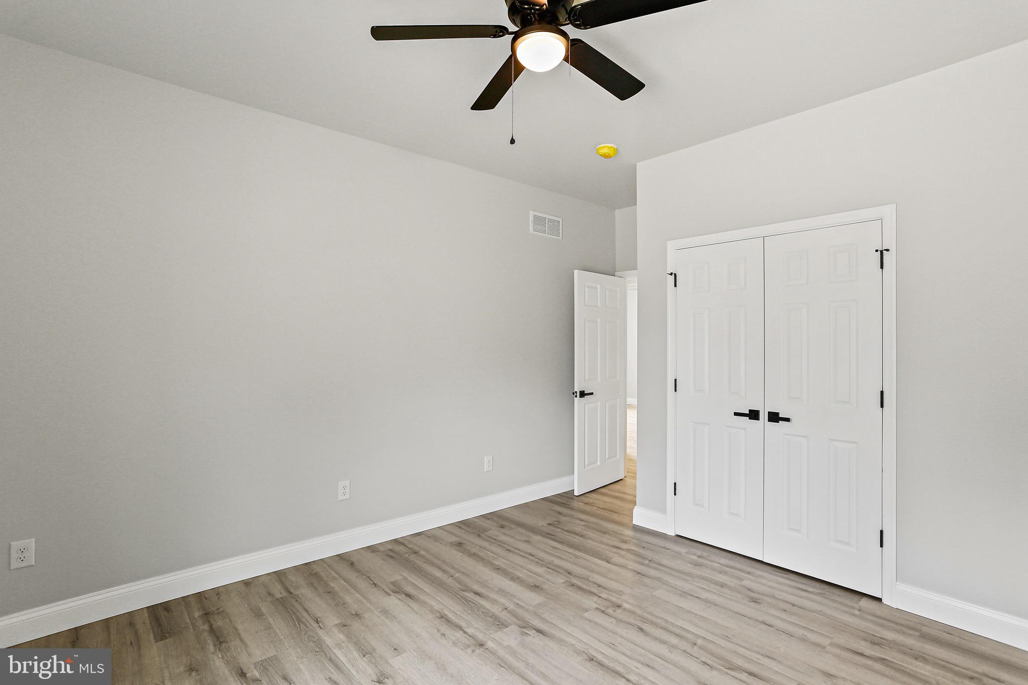 23 Juniper Road Delta, PA 17314 - Photo 14 of 33 a view of empty room with wooden floor