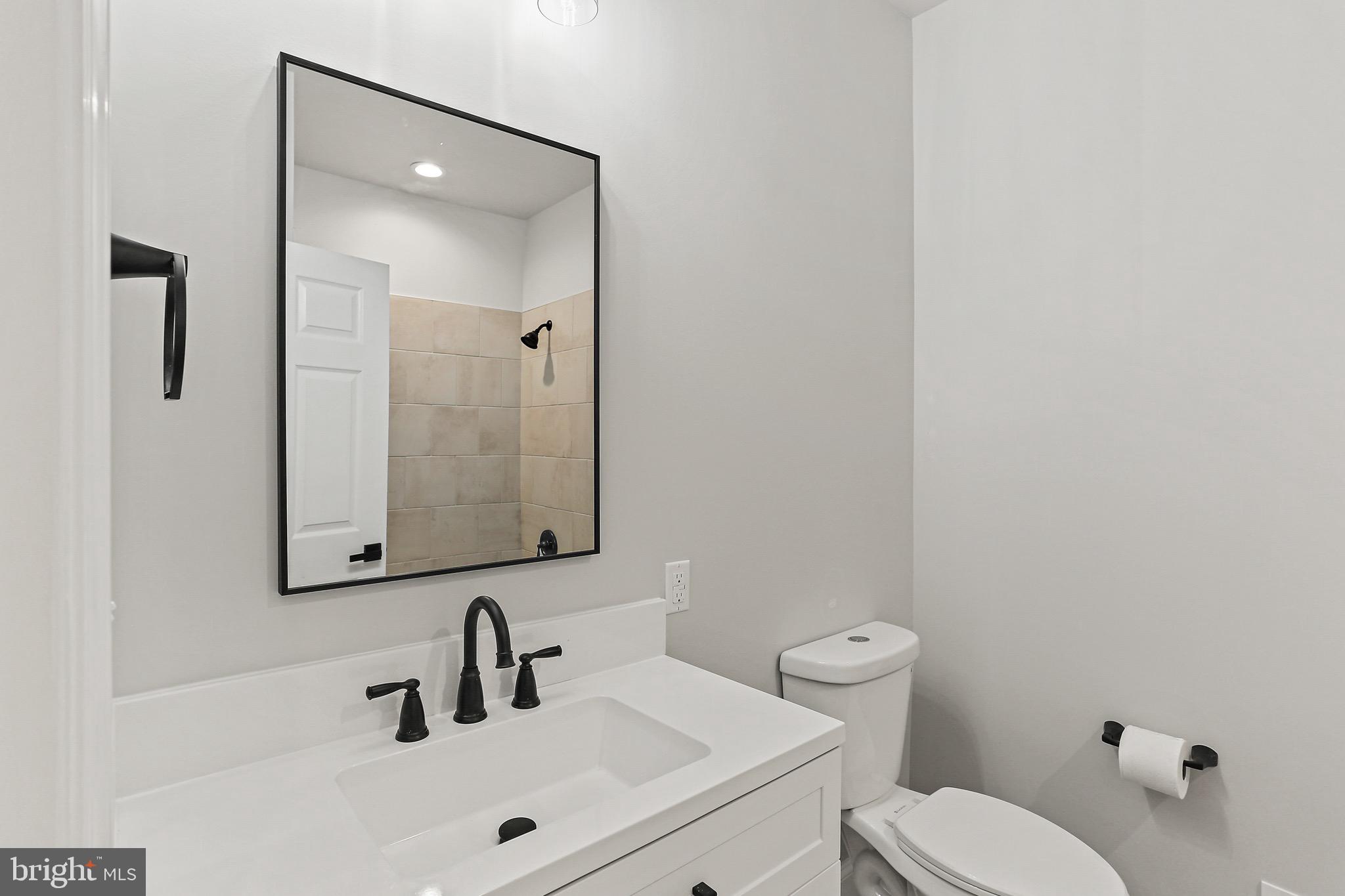 23 Juniper Road Delta, PA 17314 - Photo 15 of 33 a bathroom with a toilet sink and mirror