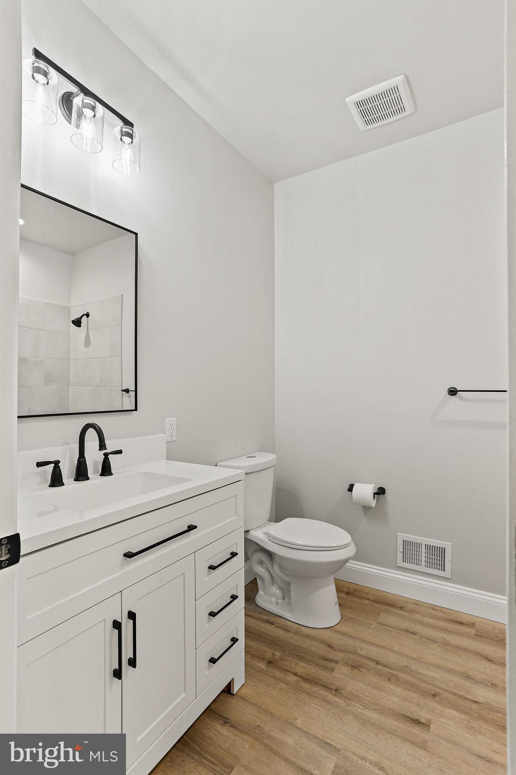 23 Juniper Road Delta, PA 17314 - Photo 16 of 33 a bathroom with a toilet a sink and mirror