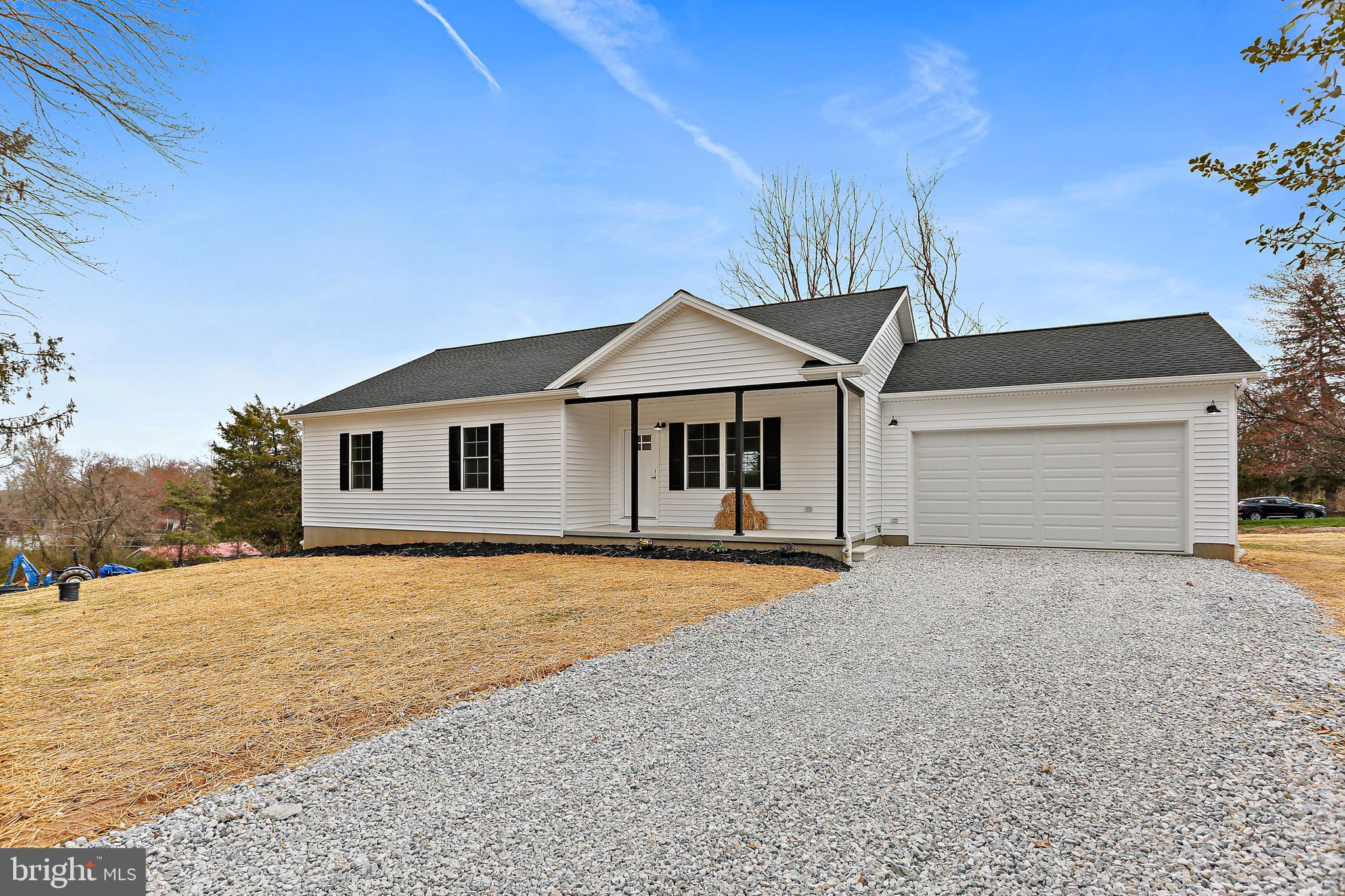 23 Juniper Road Delta, PA 17314 - Photo 2 of 33 a front view of a house with a yard and garage