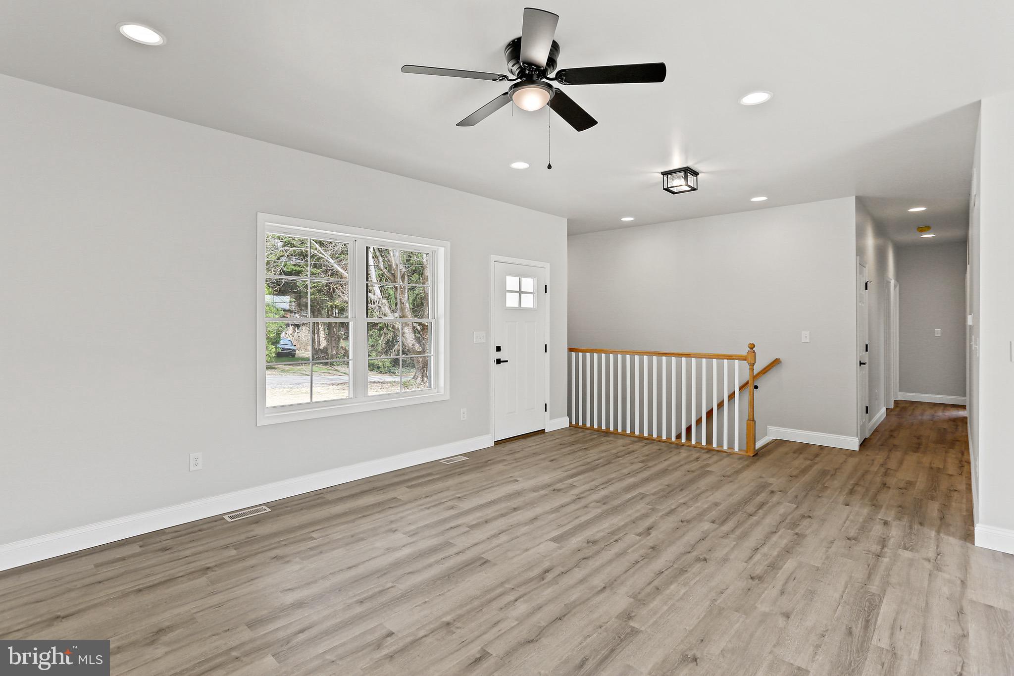 23 Juniper Road Delta, PA 17314 - Photo 21 of 33 a view of an empty room with a window and wooden floor