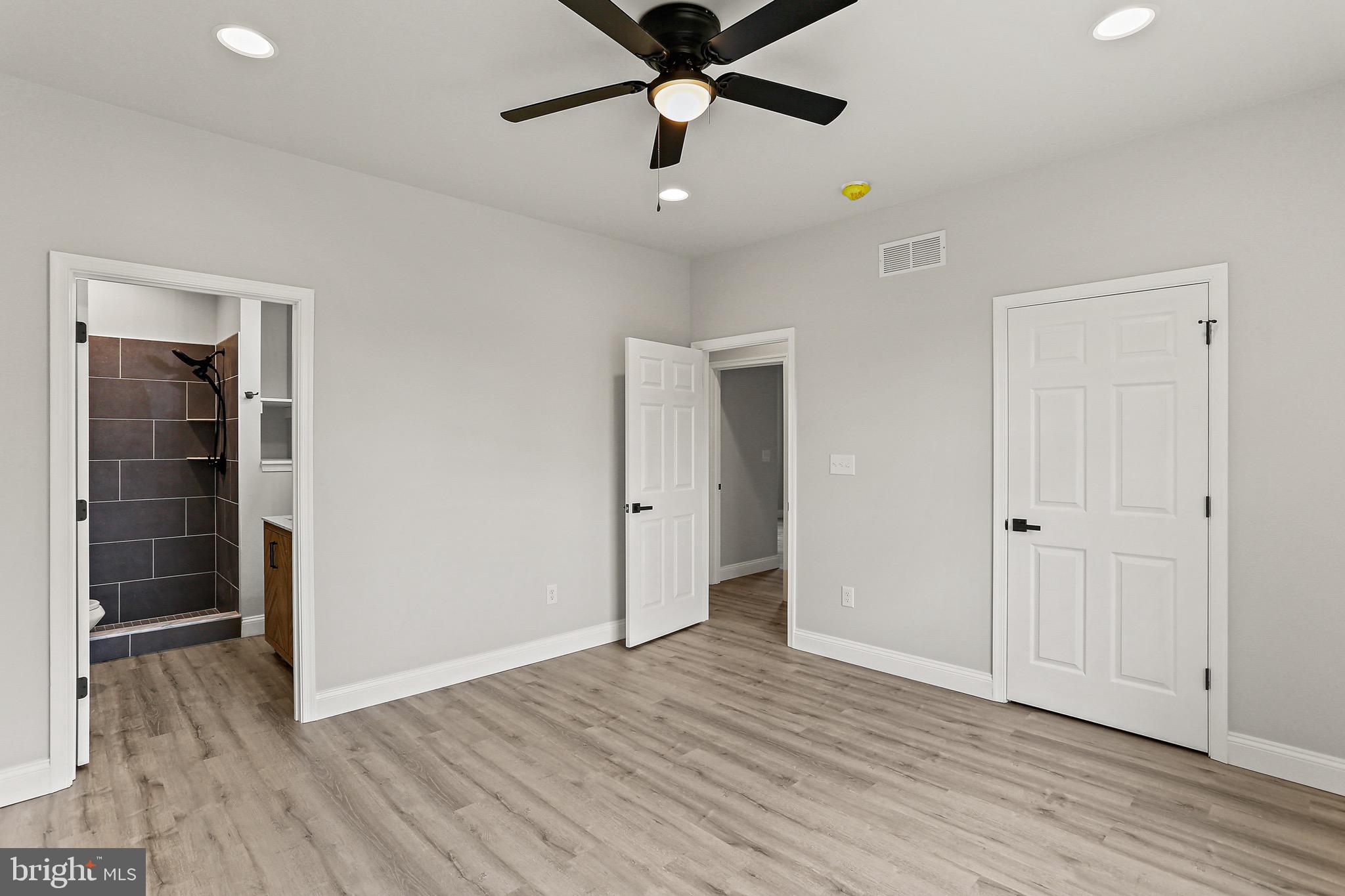 23 Juniper Road Delta, PA 17314 - Photo 7 of 33 wooden floor in an empty room with a window