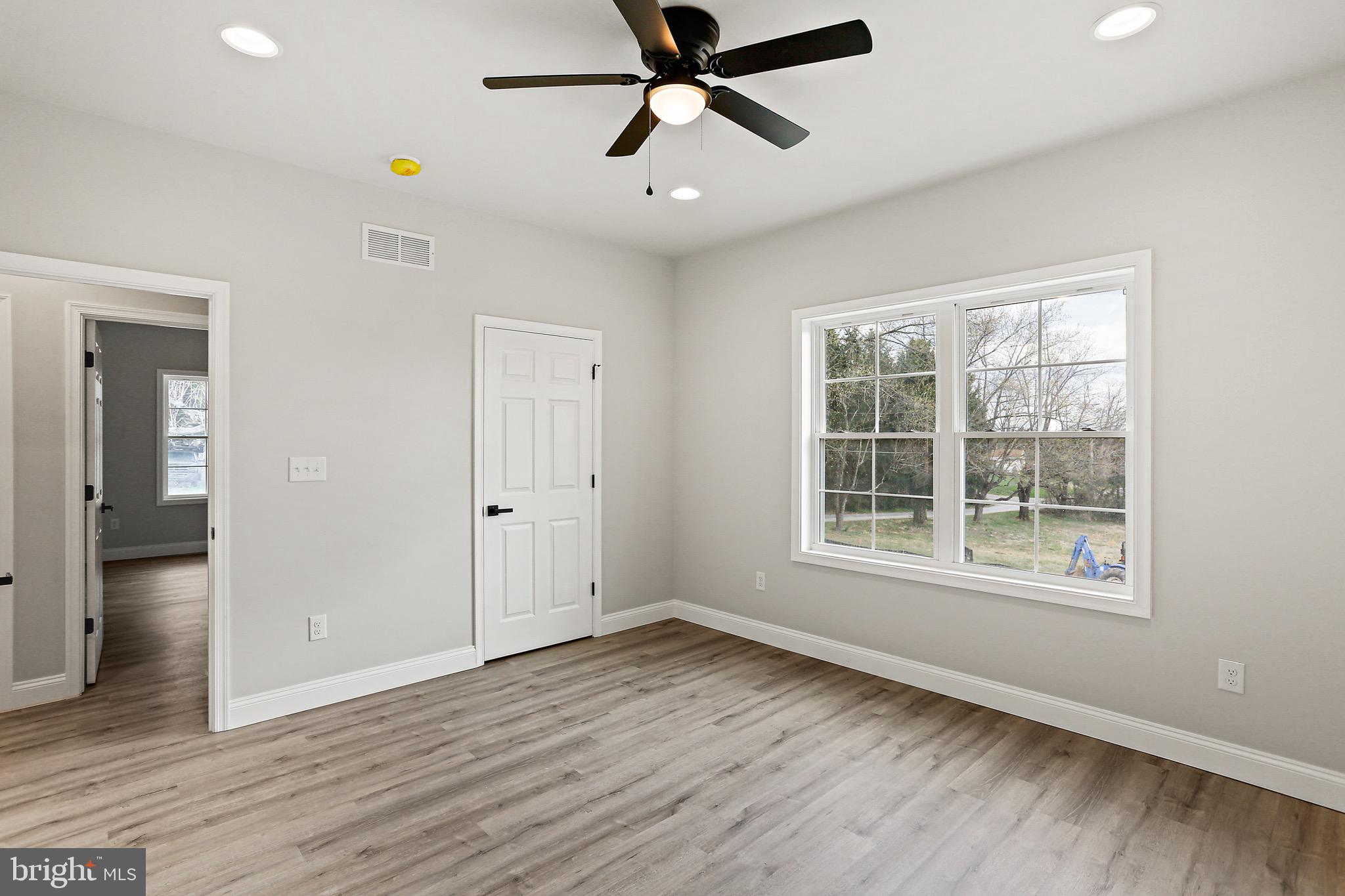 23 Juniper Road Delta, PA 17314 - Photo 8 of 33 a view of empty room with wooden floor and fan
