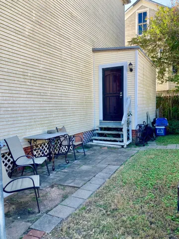 a view of two chairs in front of house