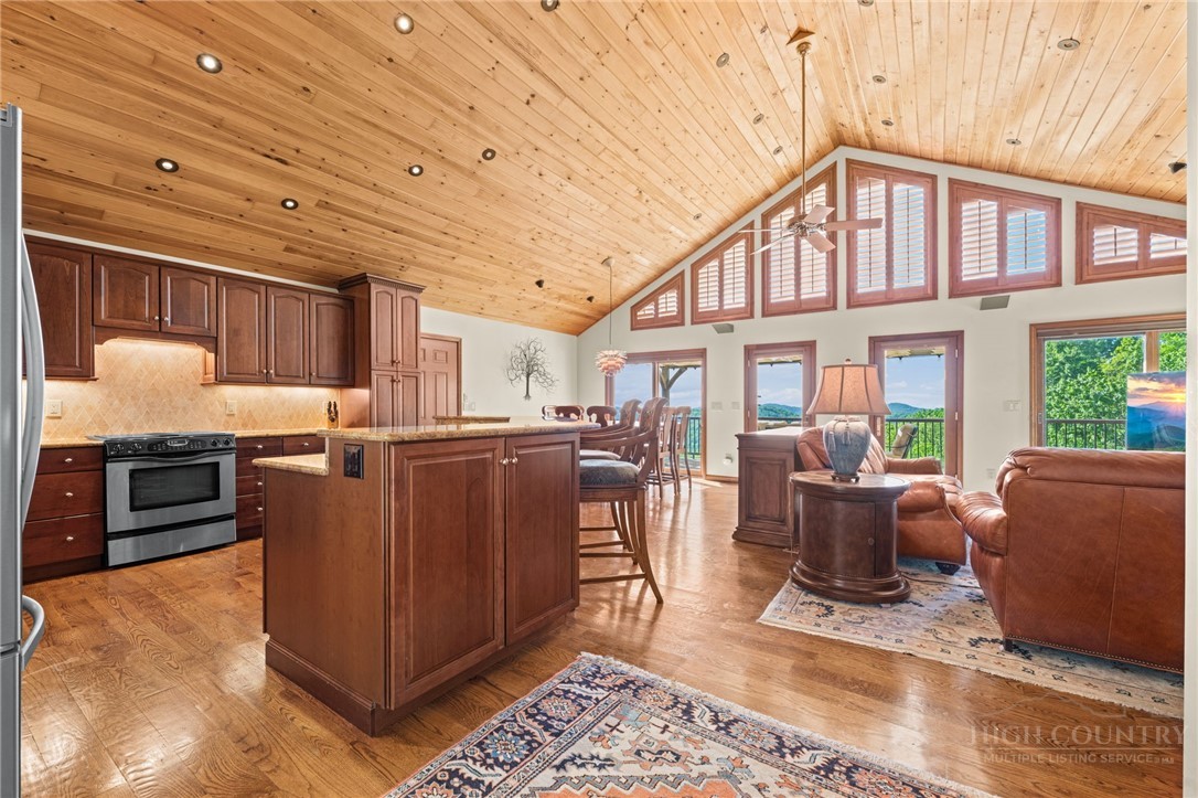 331 Alpine Road Blowing Rock, NC 28605 - Photo 15 of 50 a living room with furniture and a flat screen tv