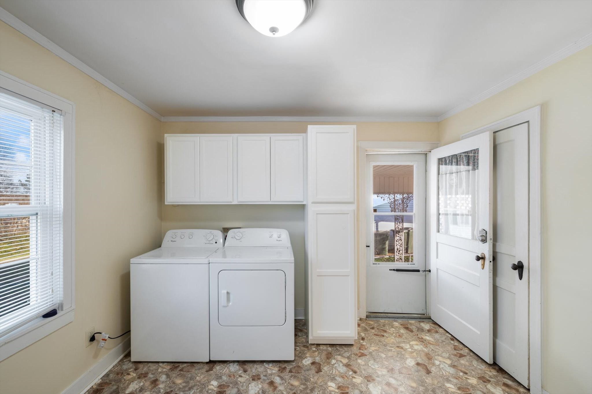 105 Arnold Street Centerville, TN 37033 - Photo 11 of 15 a utility room with cabinets washer and dryer