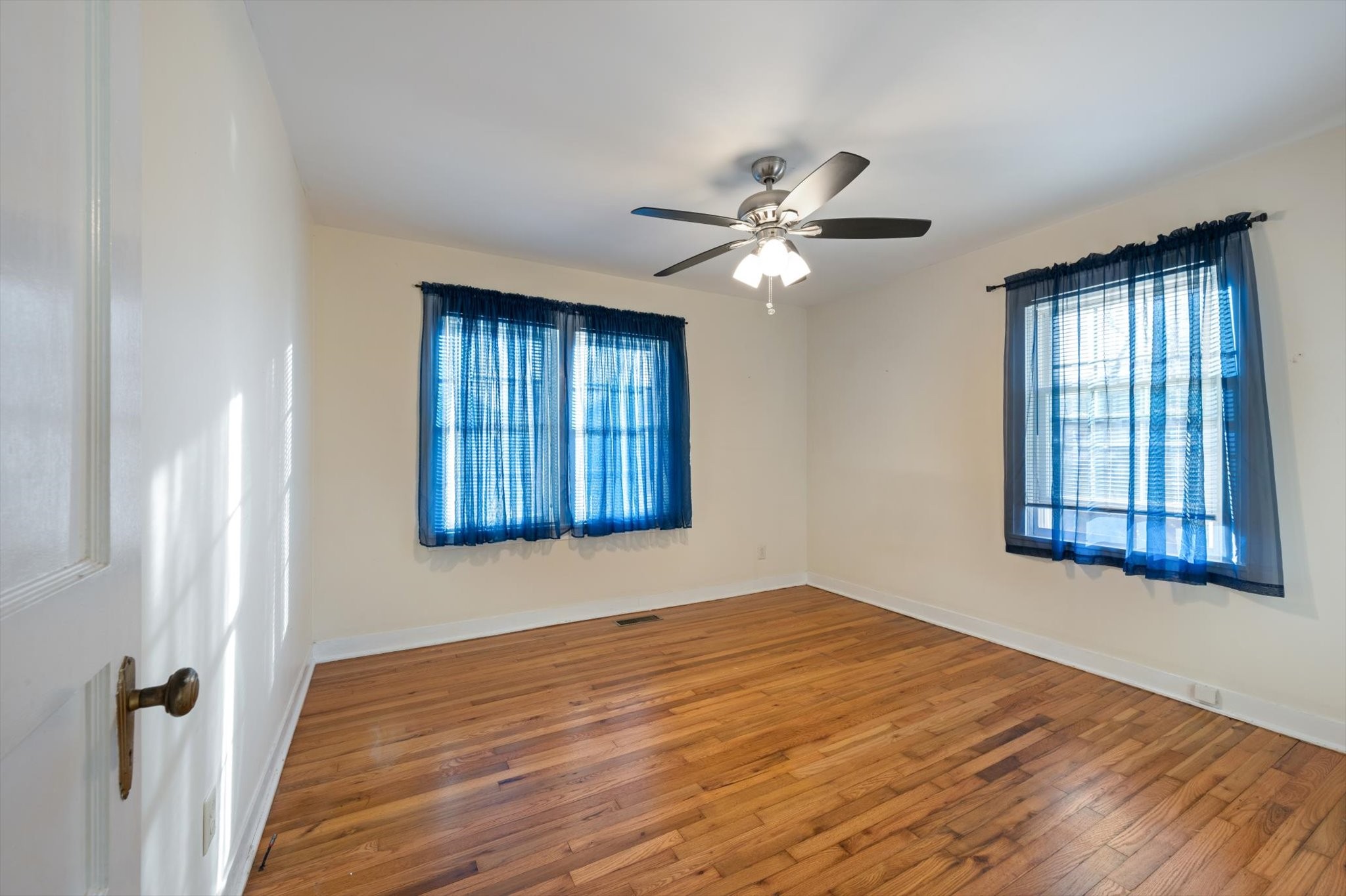 105 Arnold Street Centerville, TN 37033 - Photo 14 of 15 a view of an empty room with chandelier fan and a window