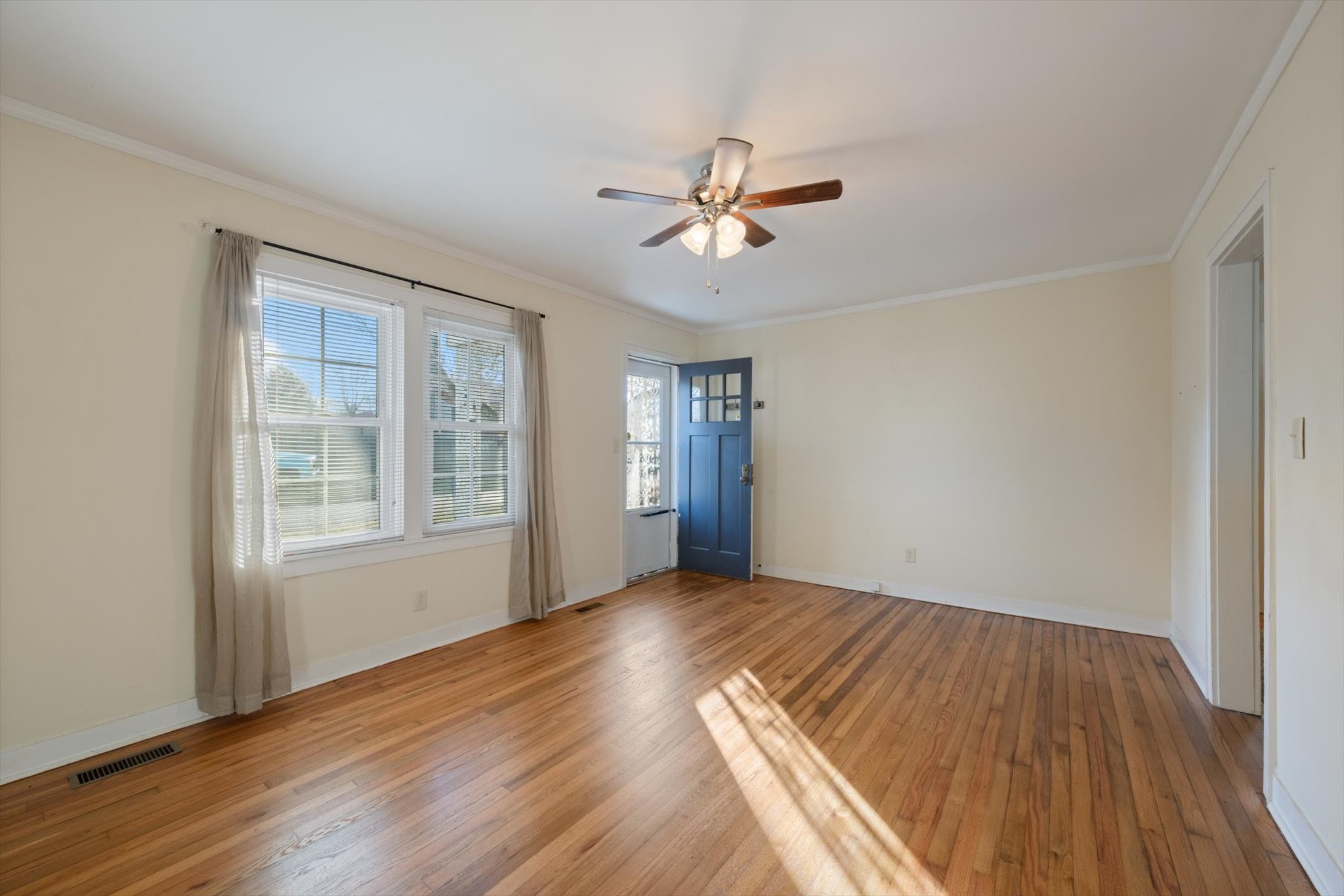 105 Arnold Street Centerville, TN 37033 - Photo 8 of 15 a view of empty room with wooden floor and fan