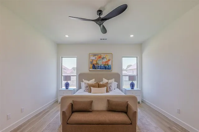 a bedroom with furniture and a window