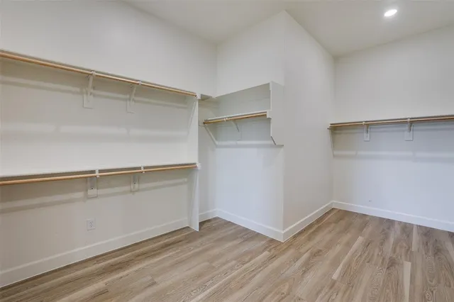 a view of an empty walk in closet