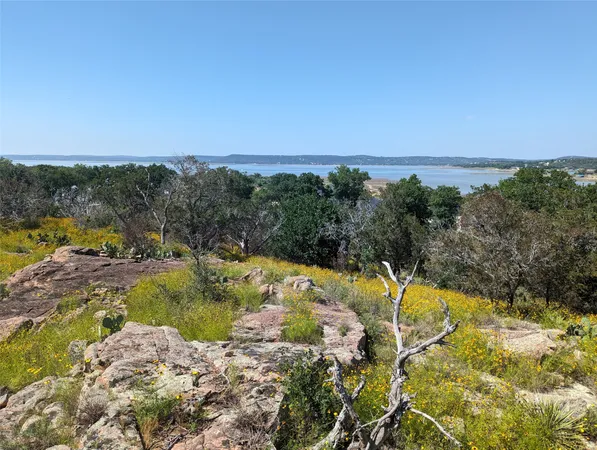 a view of a swimming pool with an ocean view