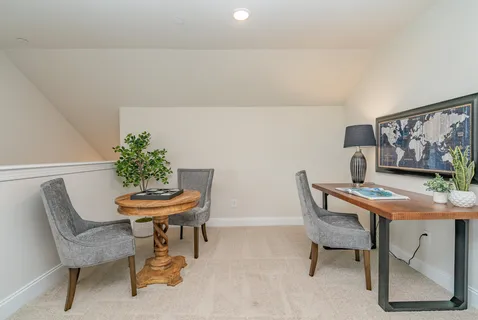 a view of a workspace with furniture