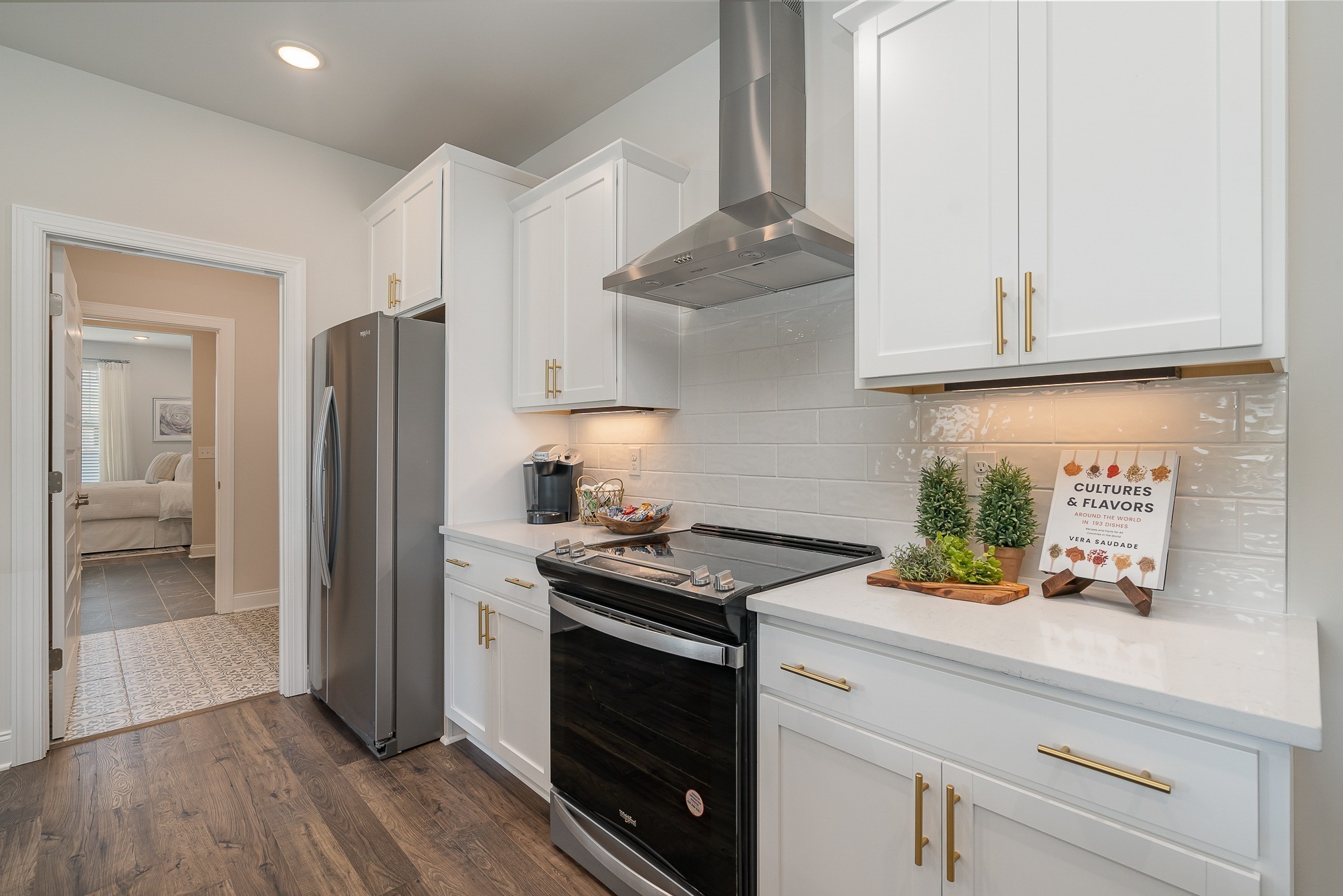 3144 Arbor Vly Road, Unit H8 Spring Hill, TN 37174 - Photo 6 of 32 a kitchen with stainless steel appliances granite countertop a refrigerator and a stove top oven