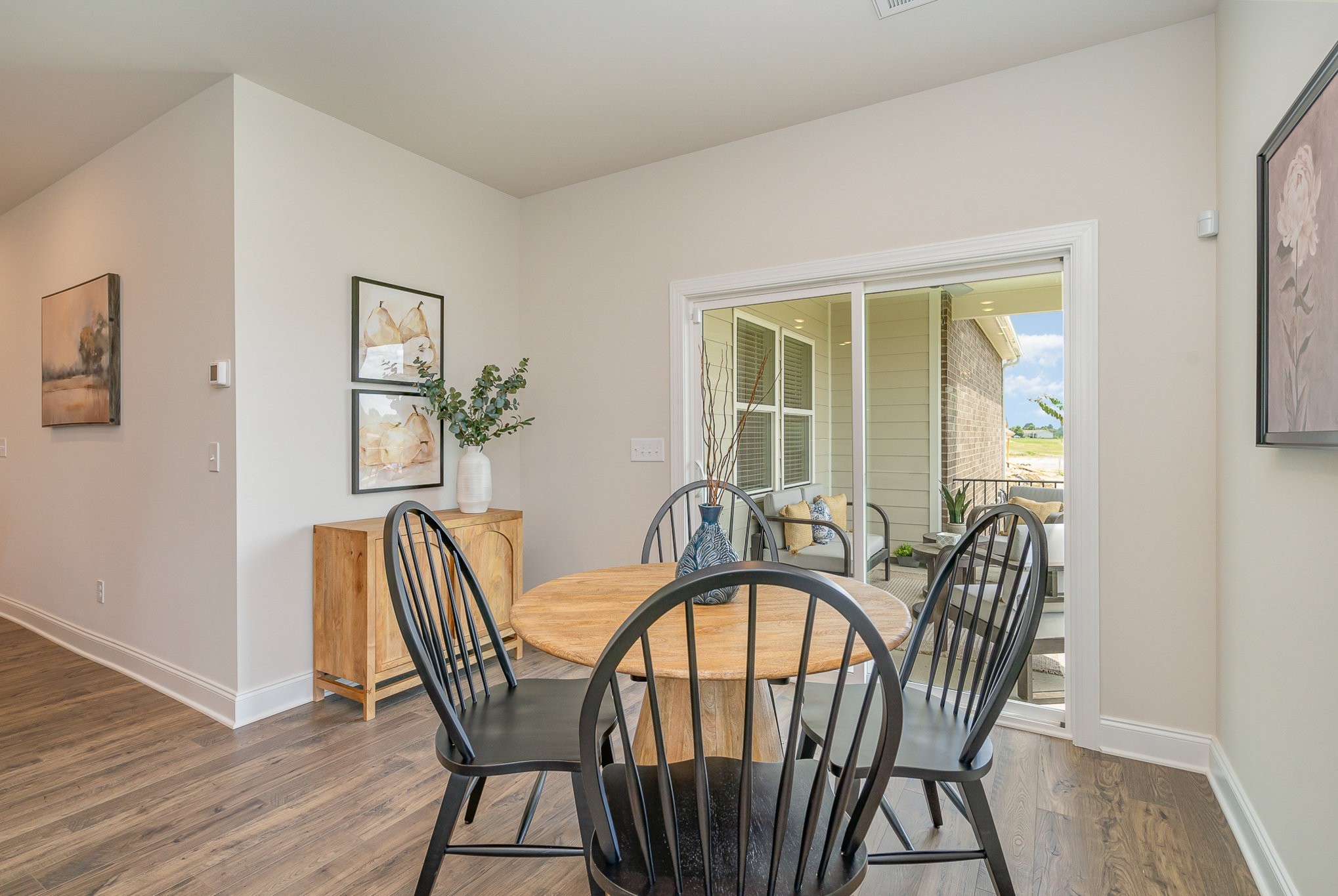 3144 Arbor Vly Road, Unit H8 Spring Hill, TN 37174 - Photo 9 of 32 a view of a dining room with furniture window and wooden floor