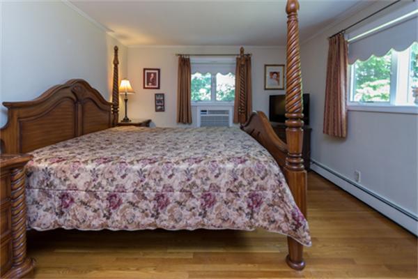 930 Central Avenue Needham, MA 02492 - Photo 11 of 21 a bedroom with a bed dresser and a window