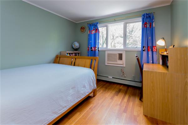 930 Central Avenue Needham, MA 02492 - Photo 12 of 21 a bedroom with bed and window