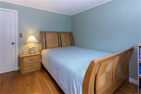 930 Central Avenue Needham, MA 02492 - Photo 13 of 21 a bedroom with a bed and dresser