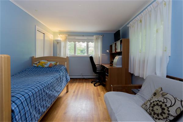 930 Central Avenue Needham, MA 02492 - Photo 14 of 21 a bedroom with bed couch and window