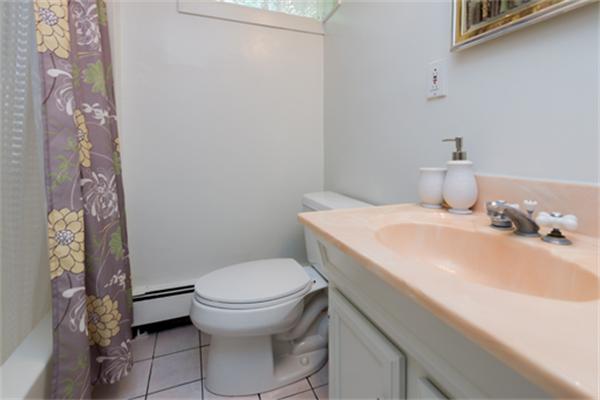 930 Central Avenue Needham, MA 02492 - Photo 17 of 21 a bathroom with a sink and a toilet
