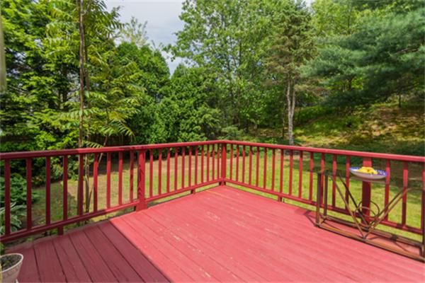 930 Central Avenue Needham, MA 02492 - Photo 18 of 21 a balcony with trees in front of it
