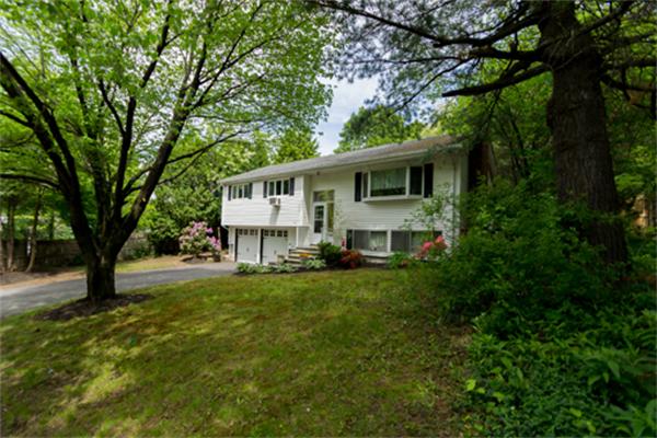 930 Central Avenue Needham, MA 02492 - Photo 20 of 21 a view of a house with backyard sitting area and garden