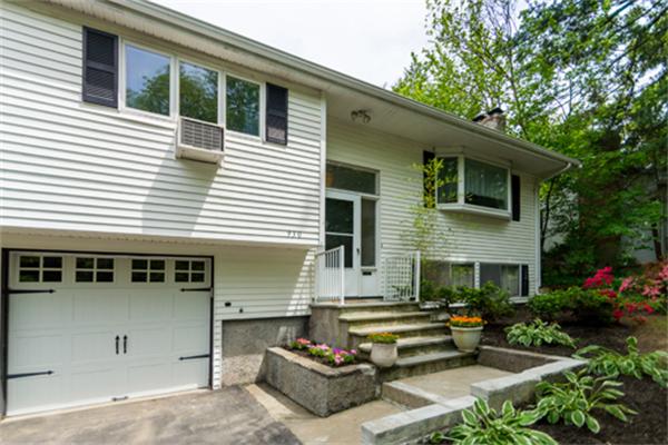 930 Central Avenue Needham, MA 02492 - Photo 21 of 21 a front view of a house with a garden