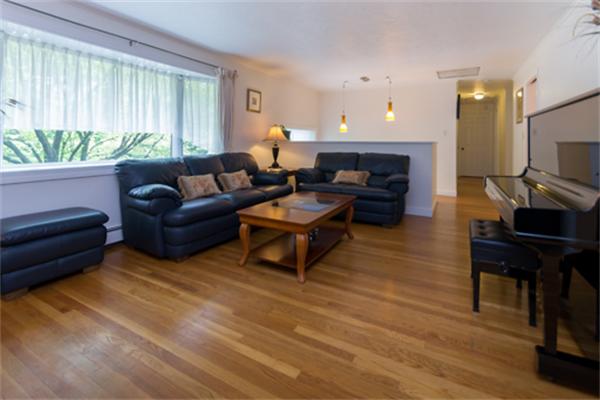930 Central Avenue Needham, MA 02492 - Photo 3 of 21 a living room with furniture and a fireplace