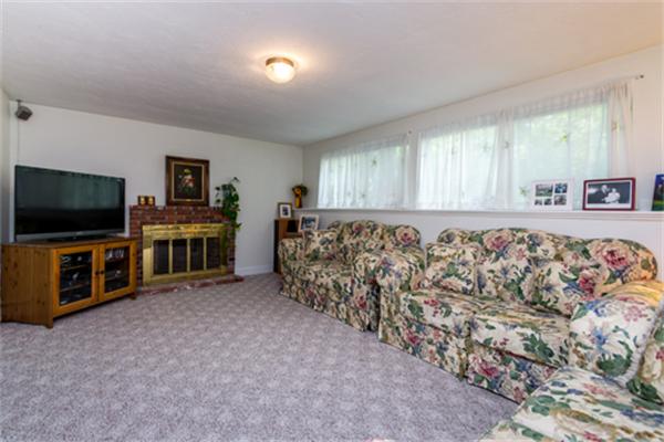 930 Central Avenue Needham, MA 02492 - Photo 8 of 21 a living room with furniture and a flat screen tv
