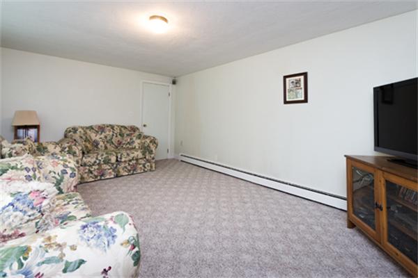 930 Central Avenue Needham, MA 02492 - Photo 9 of 21 a bedroom with a bed and a flat screen tv