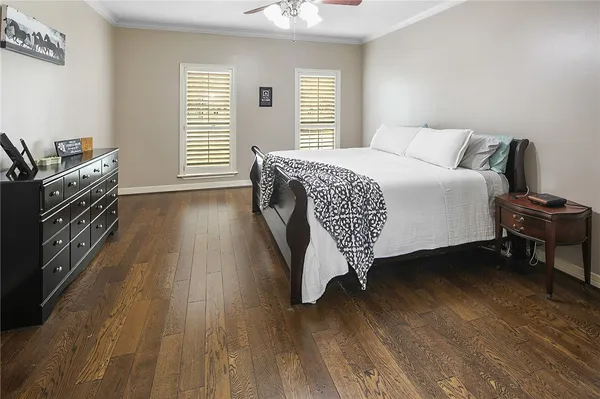 a spacious bathroom with a granite countertop sink a mirror and a