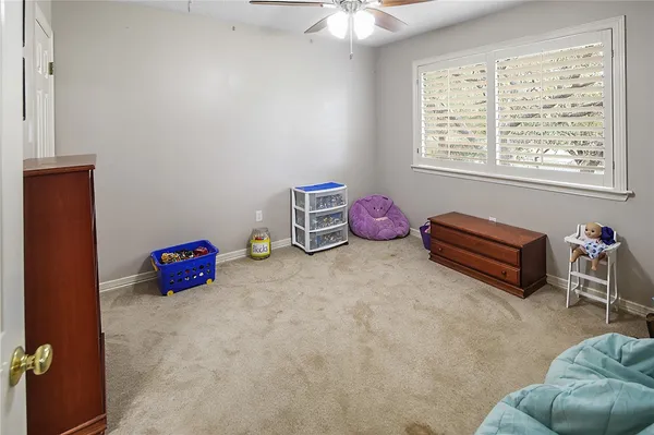 a bedroom with a bed and a desk