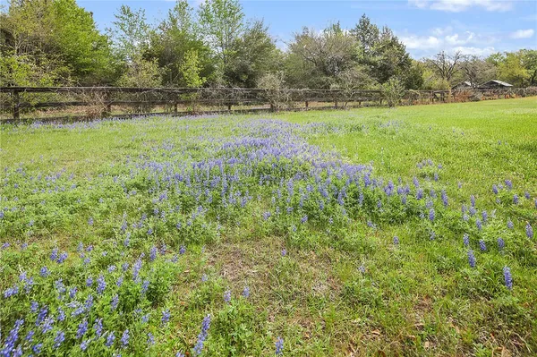 an aerial view of a house with a yard basket ball court and outdoor seating