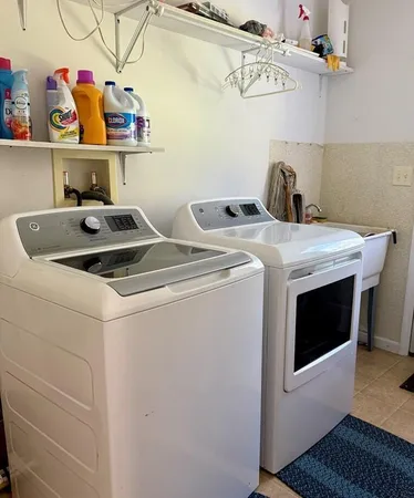 a utility room with dryer and washer