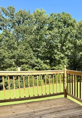 a view of a brick house with a yard