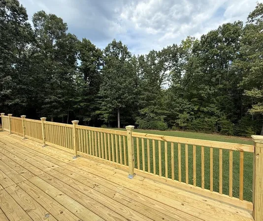 a view of deck and the trees in the background