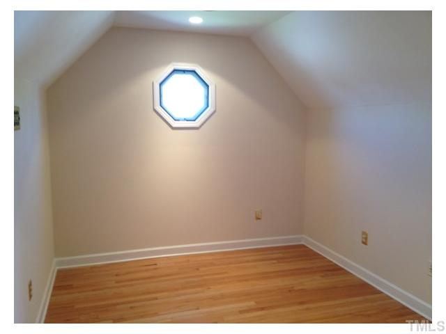 8700 Neuse Village Court Raleigh, NC 27616 - Photo 11 of 11 a view of a room with wooden floor and a window