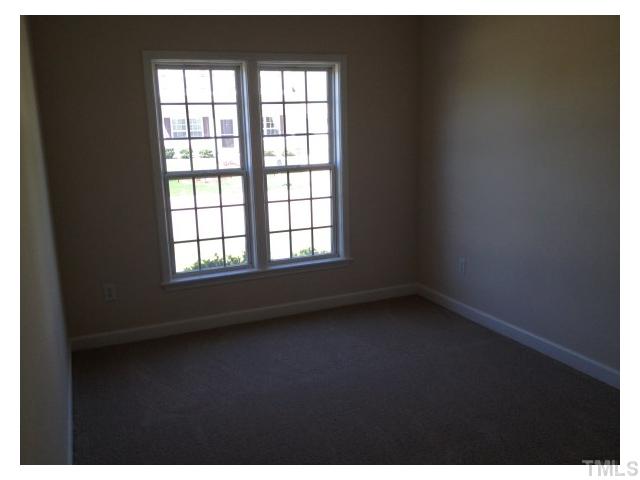 8700 Neuse Village Court Raleigh, NC 27616 - Photo 3 of 11 a view of an empty room with a window