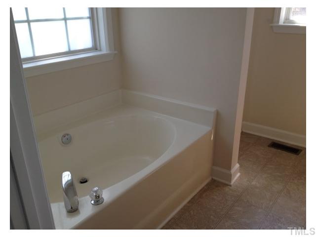 8700 Neuse Village Court Raleigh, NC 27616 - Photo 8 of 11 a bathroom with a bathtub
