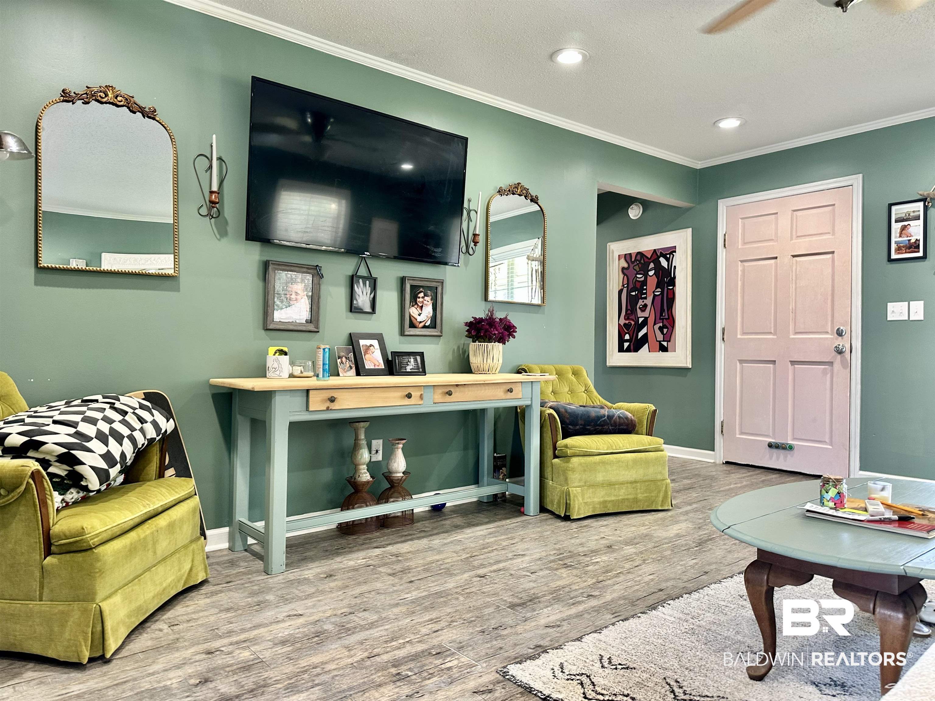 120 McGougin Road Brewton, AL 36426 - Photo 3 of 21 Living area with a textured ceiling, recessed lighting, wood finished floors, baseboards, and crown molding