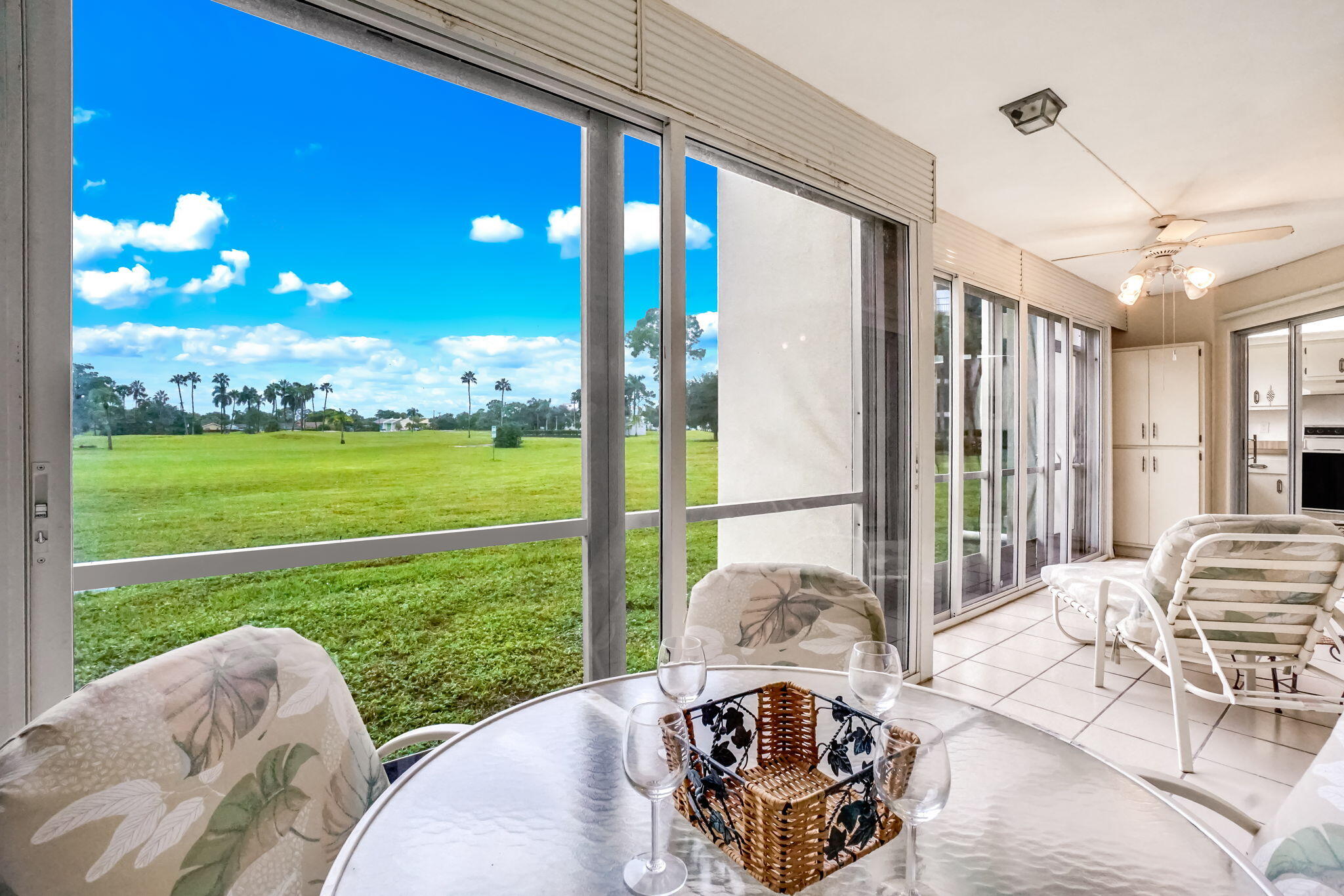3951 Via Poinciana, Unit 114 Lake Worth, FL 33467 - Photo 13 of 34 a view of a patio with a dining table and chairs