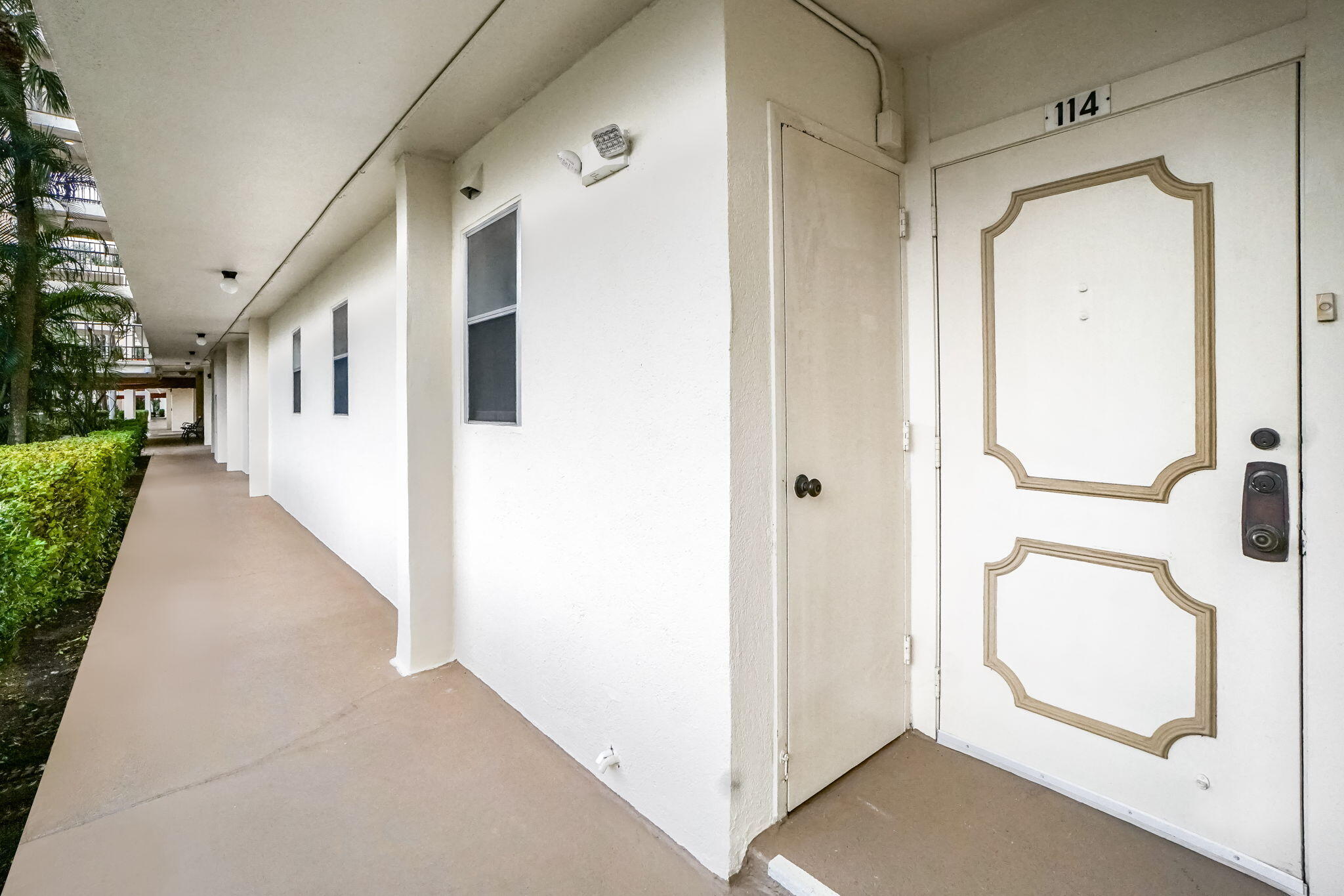 3951 Via Poinciana, Unit 114 Lake Worth, FL 33467 - Photo 2 of 34 a view of a hallway with hallway and closet