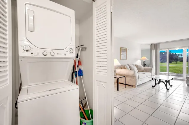 a living room with furniture and a mirror