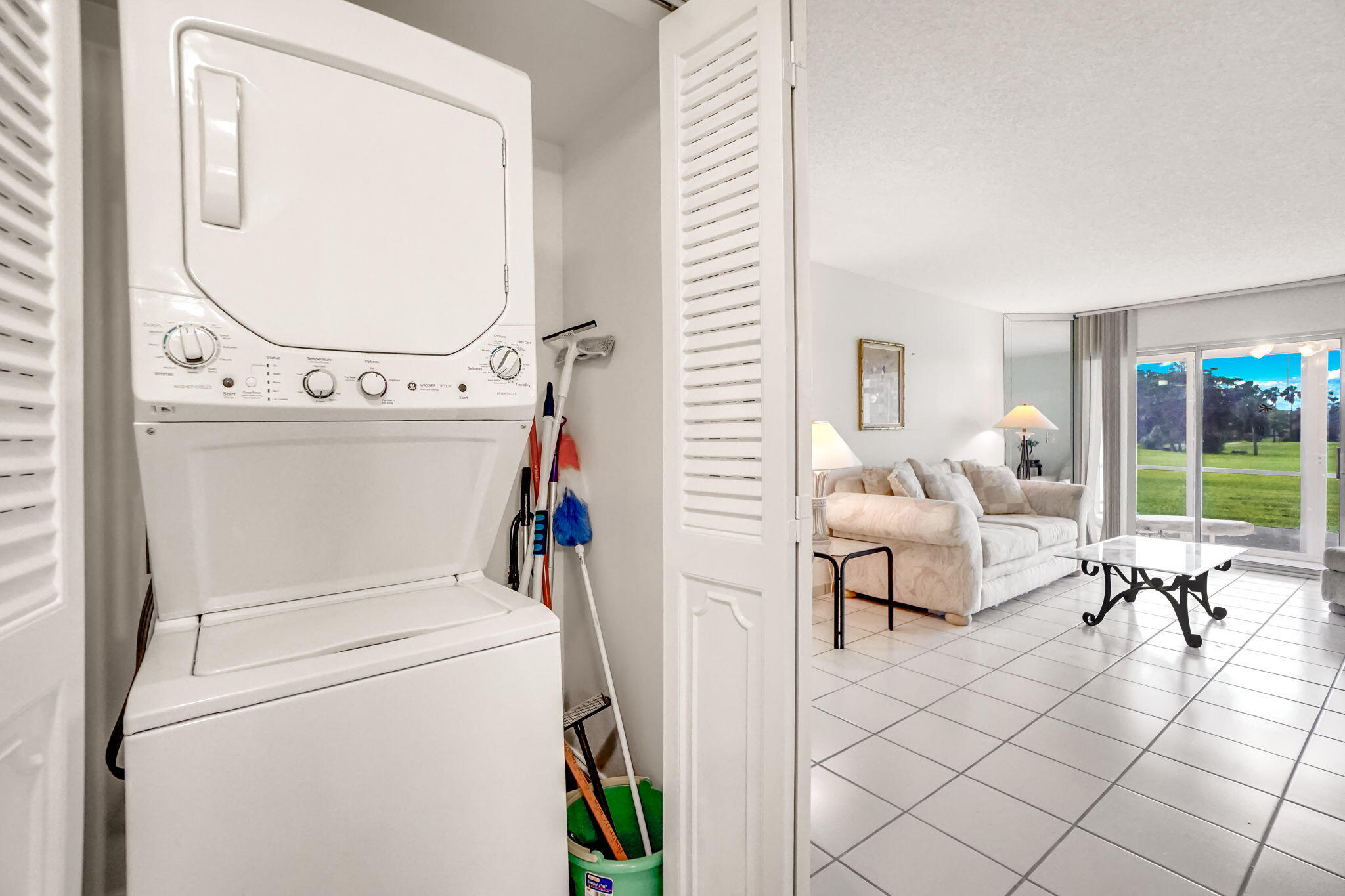 3951 Via Poinciana, Unit 114 Lake Worth, FL 33467 - Photo 23 of 34 a living room with furniture and a mirror